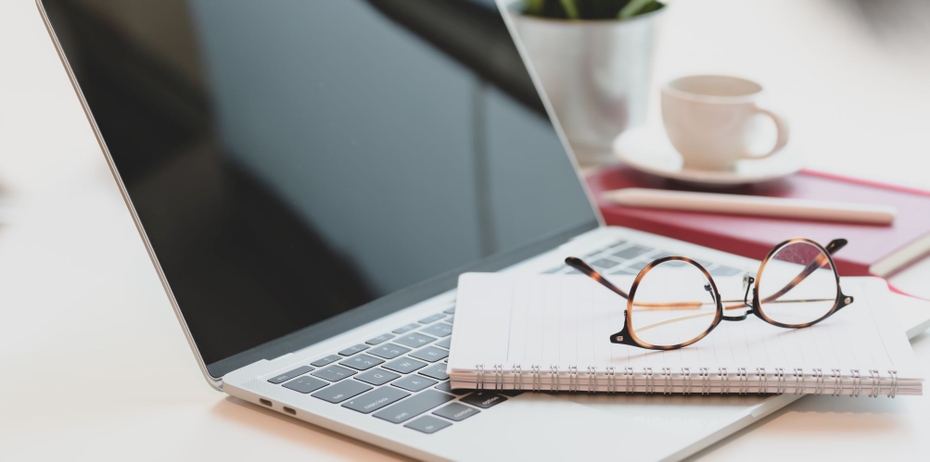 notebook, laptop, and glasses